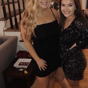 Black bodycon dress with frill detail on the top! only worn once!